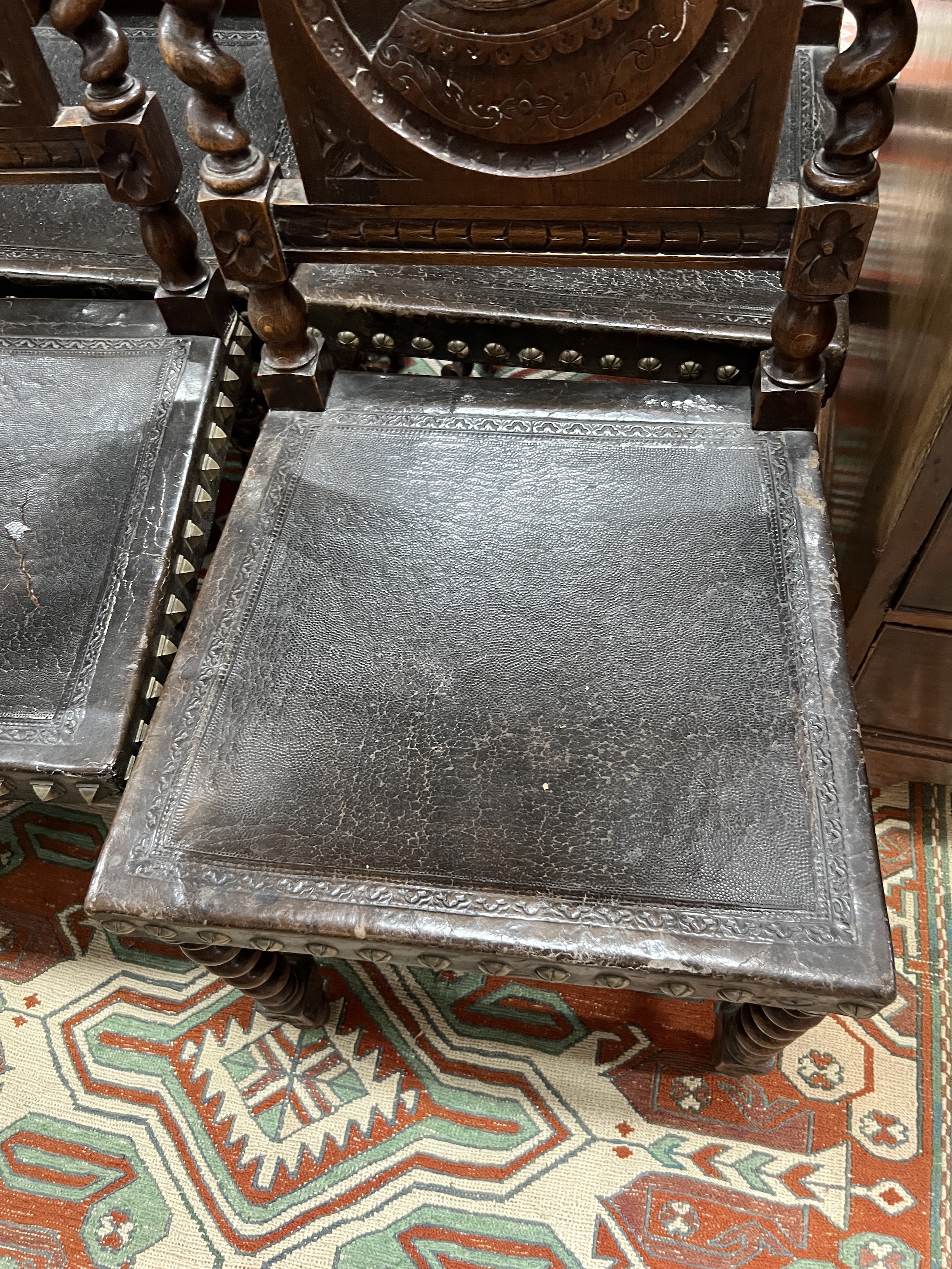 A set of six late 19th century Flemish carved oak dining chairs